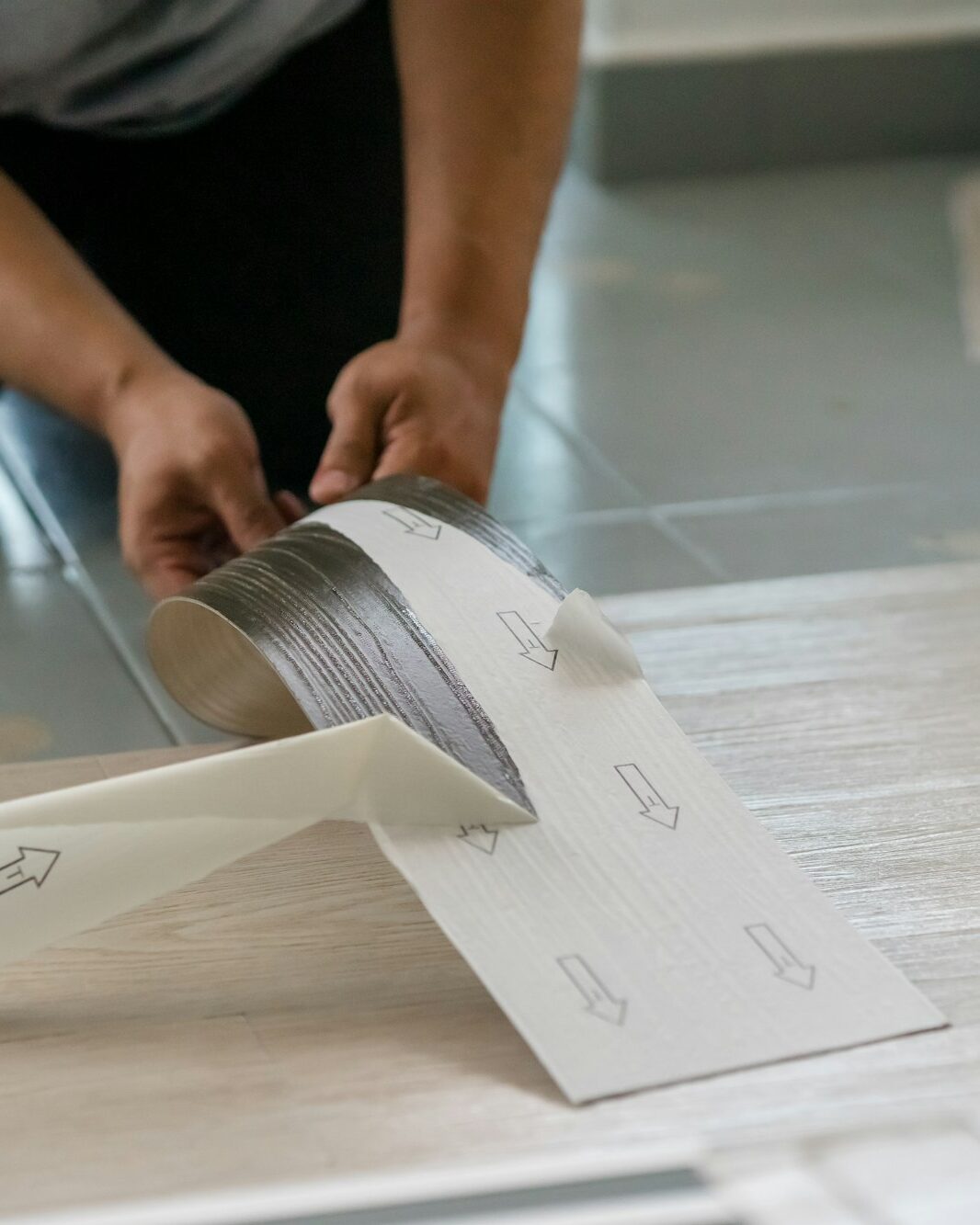 Installing vinyl flooring.